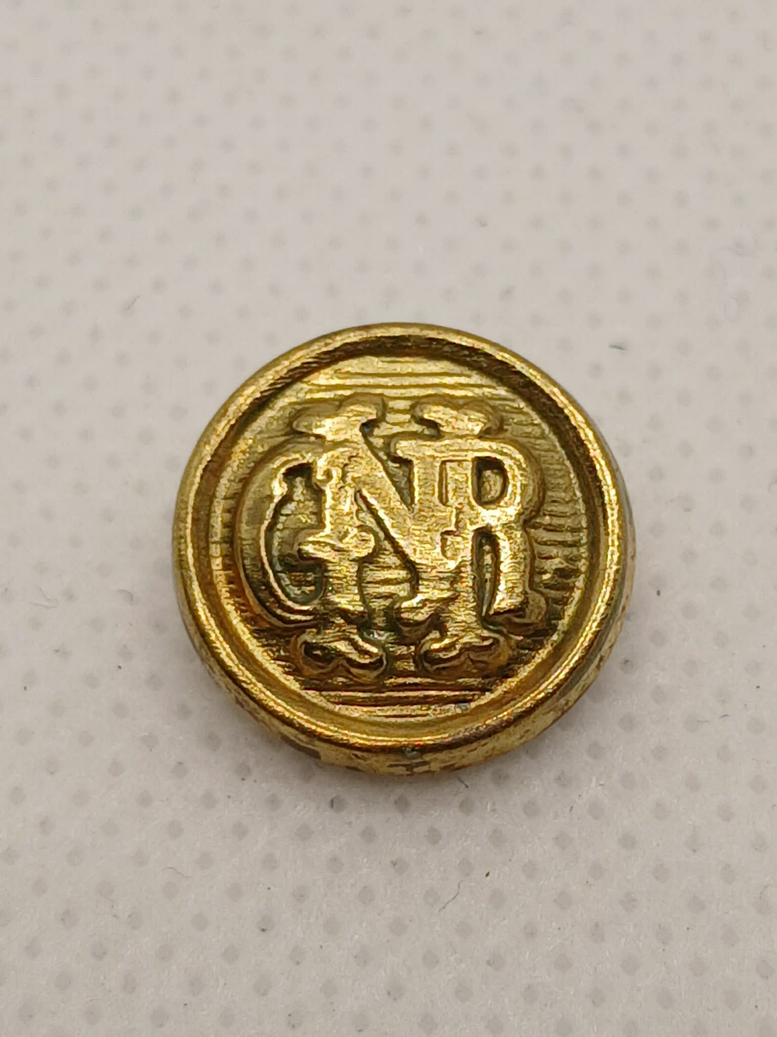 Botão pequeno para casaco GNR